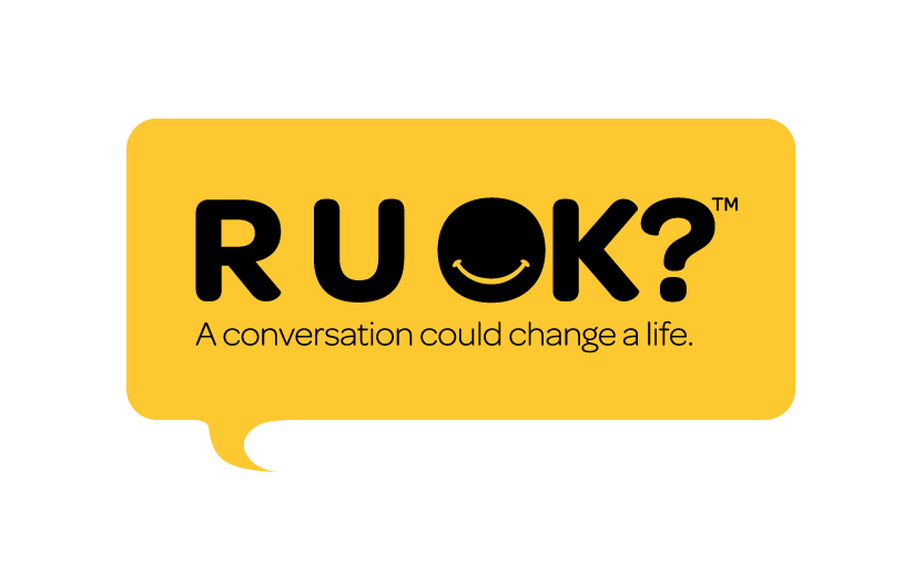Yellow speech bubble with the words R,U,O,K followed by a question mark in black letters. Underneath there is a phrase that says, A conversation could change a life.