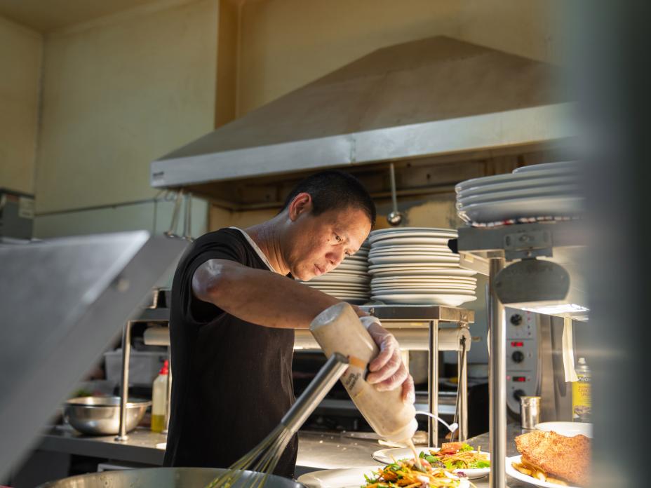 Male chef prepping food