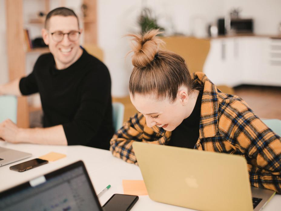 Colleagues in the workplace laughing