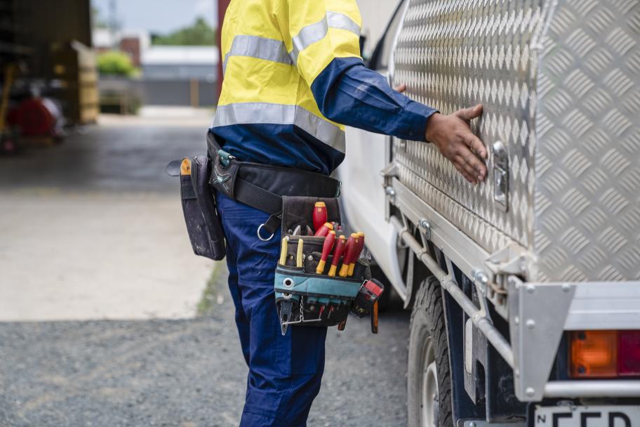 Male on construction site with car, close up