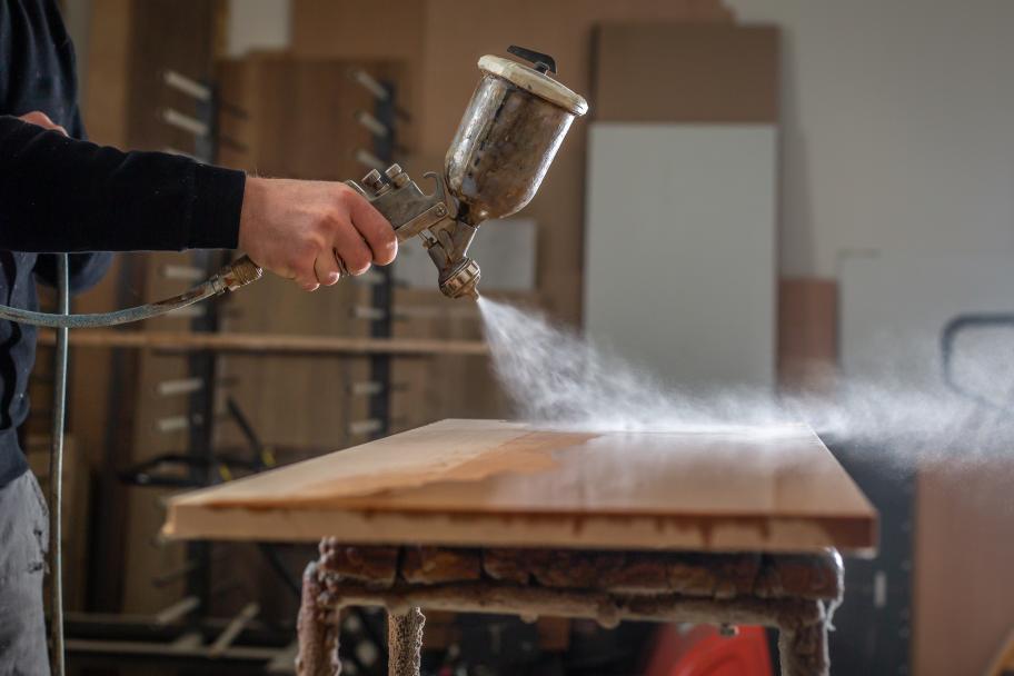 Varnish being applied to wood